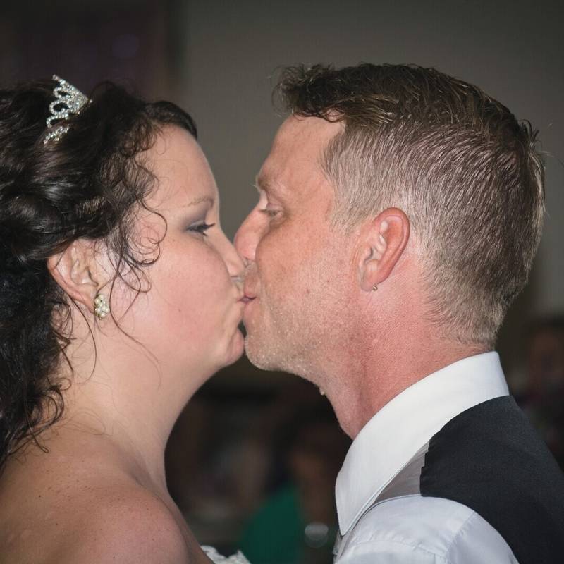 Cassandra and Jay kiss at their reception at the Owego VFW